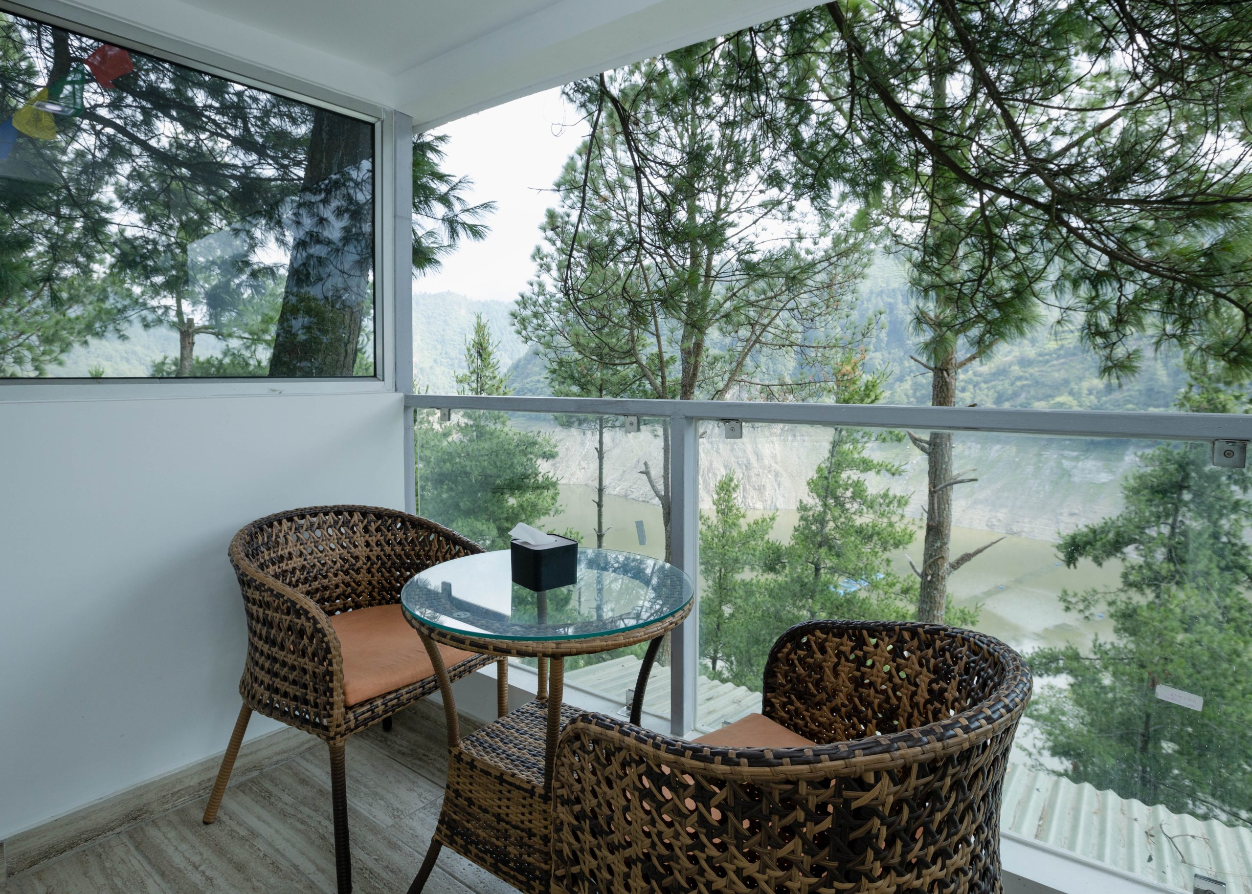 pair of chairs and a table to chill at kulekhani village resort